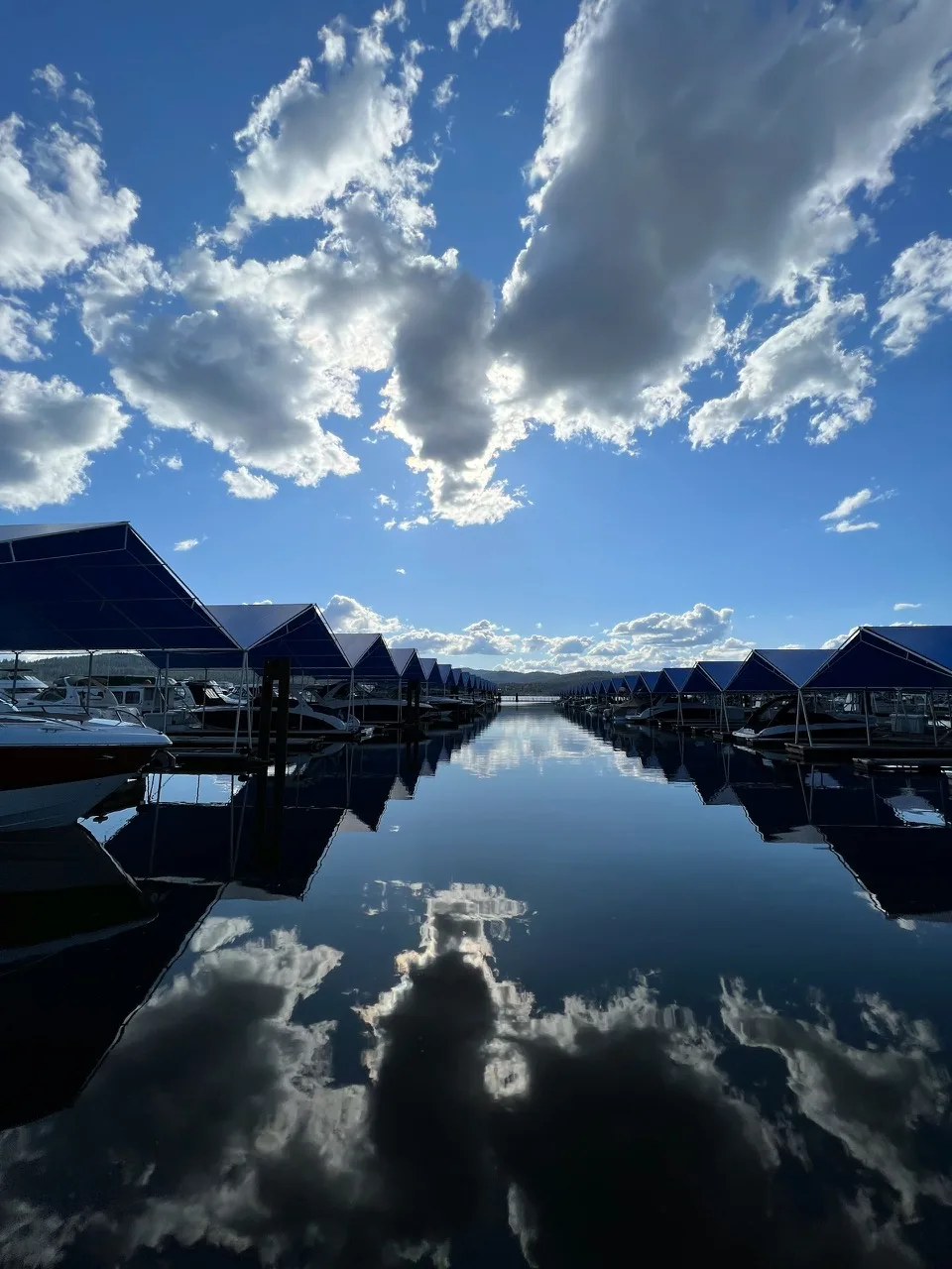 Boat slips on Lake Coeur d'Alene under a blue sky